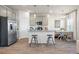 Modern kitchen features stainless steel appliances, a granite island with seating, and adjacent dining area at 11567 Kimberly Way # 25, Hampton, GA 30228