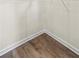 Empty walk-in closet featuring laminate flooring, white walls, and metal shelving at 11567 Kimberly Way # 25, Hampton, GA 30228