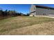 Large backyard, partially fenced with potential for outdoor activities and landscaping at 184 Weldon Rd, Mcdonough, GA 30253