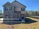 Attractive two-story home with stone accents, complemented by a well-maintained lawn at 184 Weldon Rd, Mcdonough, GA 30253
