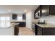 Modern kitchen with granite countertops, stainless steel appliances, and ample cabinet space at 184 Weldon Rd, Mcdonough, GA 30253