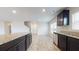 Open-concept kitchen with granite counters, sleek appliances, and views into the spacious living area at 184 Weldon Rd, Mcdonough, GA 30253
