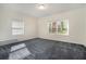 Bright bedroom featuring natural light and gray carpeting at 2210 Leafmore Dr, Decatur, GA 30033