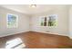 Bright bedroom with hardwood floors and large windows offering natural light at 2210 Leafmore Dr, Decatur, GA 30033