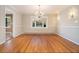 Dining room with hardwood floors, stylish lighting, and a bay window at 2210 Leafmore Dr, Decatur, GA 30033
