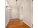 Inviting entryway featuring hardwood floors, neutral walls, elegant lighting, and classic details, creating a warm and welcoming atmosphere at 2210 Leafmore Dr, Decatur, GA 30033
