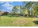 Well-maintained front yard with mature trees and a view of the house at 2210 Leafmore Dr, Decatur, GA 30033