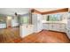 Spacious kitchen featuring tiled floors, white cabinetry, and a seamless transition into the adjacent living area for easy entertaining at 2210 Leafmore Dr, Decatur, GA 30033