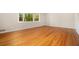 Bright living room features hardwood floors and a large window with natural light at 2210 Leafmore Dr, Decatur, GA 30033