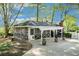 Inviting screened-in porch with a covered patio and landscaped yard at 2210 Leafmore Dr, Decatur, GA 30033