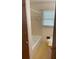 Neutral bathroom featuring a bathtub/shower, vanity, and window for natural light at 1150 Orchard Way, Roswell, GA 30075