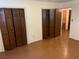 Bedroom with wood floors and closets at 1150 Orchard Way, Roswell, GA 30075