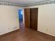 Bedroom featuring wood floors, with a wallpaper border, and closet at 1150 Orchard Way, Roswell, GA 30075