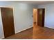 Bedroom features wood floors, and two doors to other rooms at 1150 Orchard Way, Roswell, GA 30075