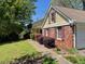 Charming home with manicured bushes and a sidewalk leading to the entrance at 1150 Orchard Way, Roswell, GA 30075