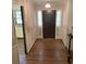 Inviting foyer with hardwood floors, chandelier, and windows that let in natural light at 1150 Orchard Way, Roswell, GA 30075