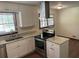 Bright kitchen with granite countertops, stainless steel appliances, and modern cabinetry at 1150 Orchard Way, Roswell, GA 30075