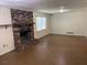 Living room featuring a brick fireplace and natural light from windows at 1150 Orchard Way, Roswell, GA 30075