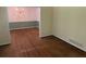 Bright living room featuring hardwood floors and an entry into the dining room at 1150 Orchard Way, Roswell, GA 30075