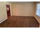 Cozy living room with hardwood floors, and large window with natural light at 1150 Orchard Way, Roswell, GA 30075