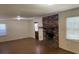 The living room features a brick fireplace and natural light from windows at 1150 Orchard Way, Roswell, GA 30075