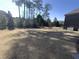 Expansive backyard with lush trees, offering privacy and plenty of space for outdoor activities at 13015 Fox Rd, Alpharetta, GA 30005