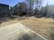 Large backyard featuring a patio area, ideal for outdoor gatherings and relaxation at 13015 Fox Rd, Alpharetta, GA 30005