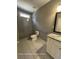 Modern bathroom with glass shower, granite countertop, and tile floors at 13015 Fox Rd, Alpharetta, GA 30005