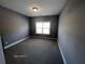 Gray bedroom with plush carpet, window and natural light at 13015 Fox Rd, Alpharetta, GA 30005