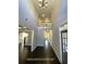 Grand two-story foyer featuring hardwood floors and views into other areas of the home at 13015 Fox Rd, Alpharetta, GA 30005
