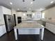 Beautiful kitchen featuring white cabinets, stainless steel appliances, granite countertops, and a center island at 13015 Fox Rd, Alpharetta, GA 30005