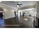 Spacious open concept living room featuring hardwood floors and a direct view into the kitchen at 13015 Fox Rd, Alpharetta, GA 30005