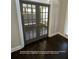 Private office featuring french doors, hardwood floors, and ample natural light at 13015 Fox Rd, Alpharetta, GA 30005