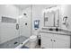Modern bathroom featuring granite countertop vanity, a glass enclosed shower, and updated fixtures at 1660 Norris Landing Dr, Snellville, GA 30039