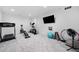 Well-equipped exercise room with carpet and a variety of equipment for a complete workout at 1660 Norris Landing Dr, Snellville, GA 30039