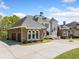 Stately home featuring a circular driveway, and manicured landscaping at 1660 Norris Landing Dr, Snellville, GA 30039