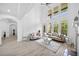 Light-filled living room boasts soaring ceilings, sleek floors, neutral walls and gorgeous windows at 1660 Norris Landing Dr, Snellville, GA 30039