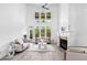 Living room featuring high ceilings, fireplace and light wood-look floors at 1660 Norris Landing Dr, Snellville, GA 30039