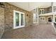 Expansive brick patio featuring tiled floors and providing seamless indoor/outdoor living at 1660 Norris Landing Dr, Snellville, GA 30039