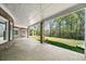 Expansive covered patio overlooking the green backyard, great for outdoor entertaining and relaxing at 1660 Norris Landing Dr, Snellville, GA 30039