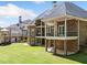 Beautiful brick home featuring multiple levels with covered decks and spacious outdoor areas at 1660 Norris Landing Dr, Snellville, GA 30039