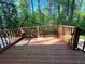 Inviting back deck, perfect for outdoor dining and relaxing with a decorative fire pot at 185 Maple Wood Dr, Lawrenceville, GA 30046