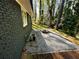View of home's side with gravel yard, fire pit, and brick accents at 185 Maple Wood Dr, Lawrenceville, GA 30046
