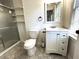 Bathroom featuring a white sink, toilet, and walk-in shower at 185 Maple Wood Dr, Lawrenceville, GA 30046