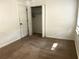 Bedroom featuring plush carpeting, a window for natural light, and a closet for storage at 185 Maple Wood Dr, Lawrenceville, GA 30046