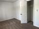 Bedroom featuring plush carpeting, a window for natural light, and a closet for storage at 185 Maple Wood Dr, Lawrenceville, GA 30046