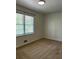 Inviting bedroom with cozy carpeting, a large window, and neutral walls for a relaxing ambiance at 185 Maple Wood Dr, Lawrenceville, GA 30046