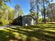 A beautiful home featuring a backyard with a deck and fire pit at 185 Maple Wood Dr, Lawrenceville, GA 30046