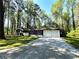 Charming single-story home with well-maintained lawn and two-car garage at 185 Maple Wood Dr, Lawrenceville, GA 30046
