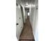 Hallway with carpet flooring and multiple doors leading to various rooms at 185 Maple Wood Dr, Lawrenceville, GA 30046